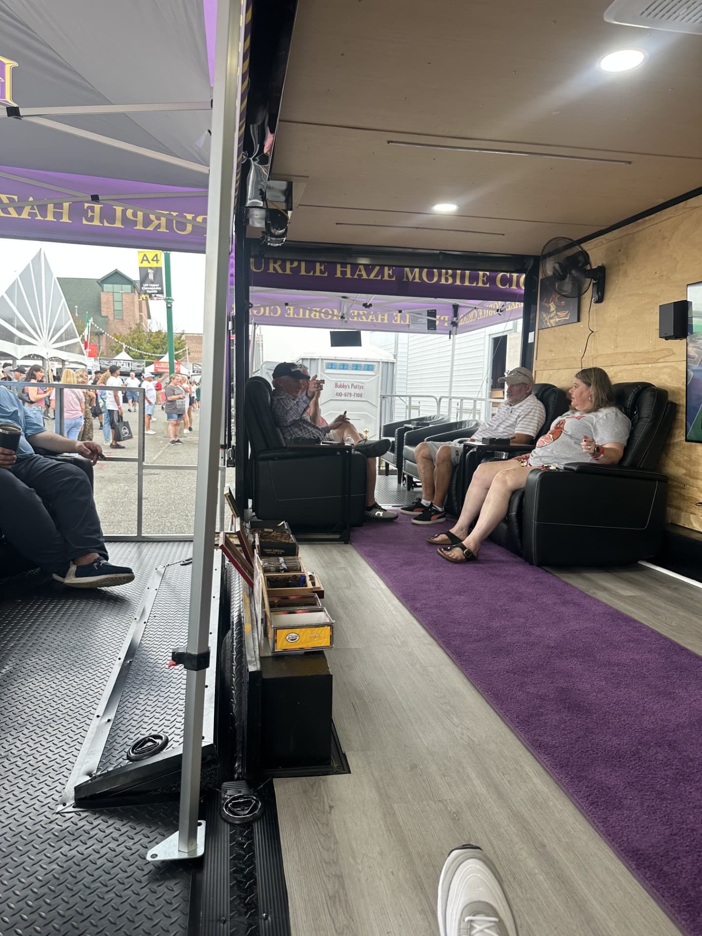 Premium cigar experience at corporate event with luxury seating